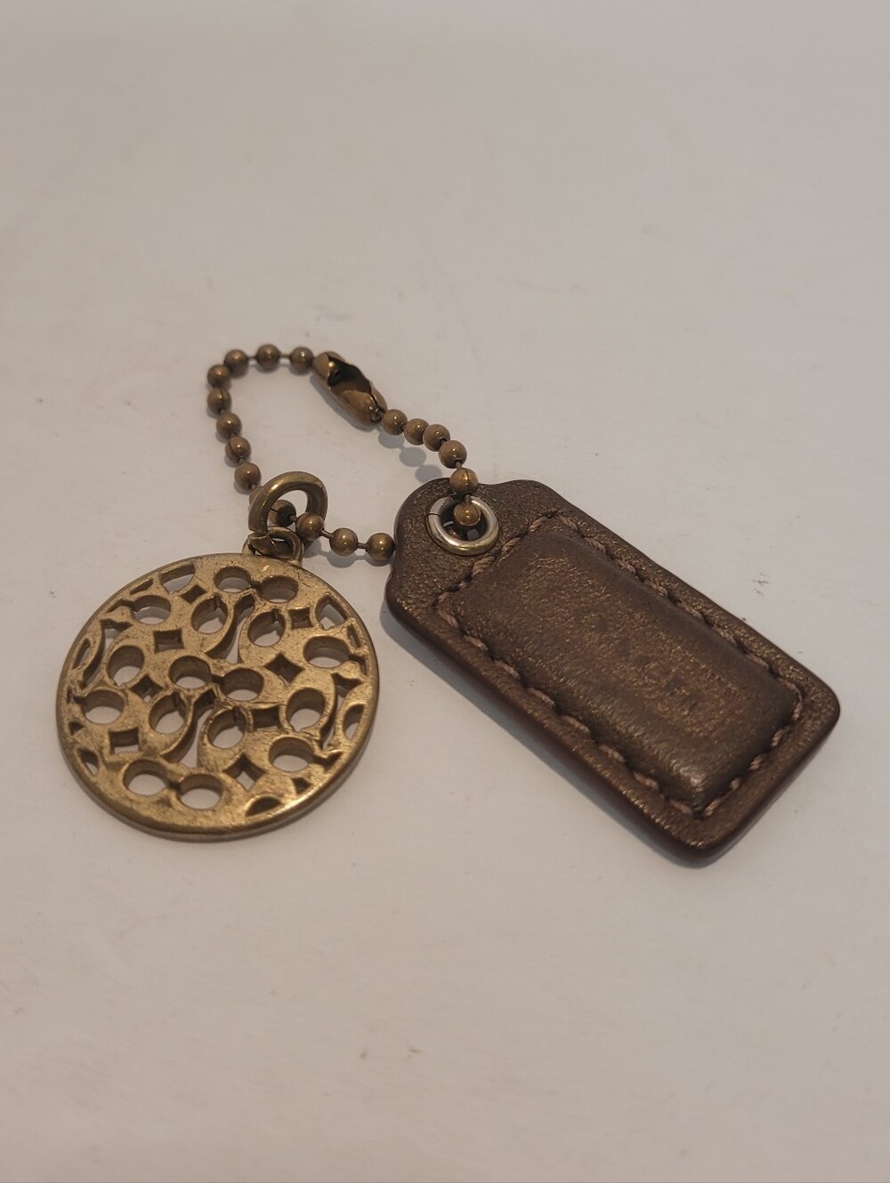 Cach Gold Tone Charm And Leather Tag